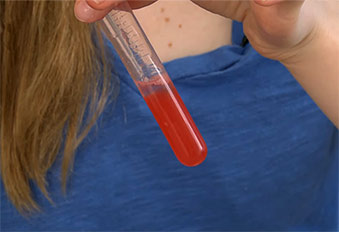 Close up of test tube with strawberry extract